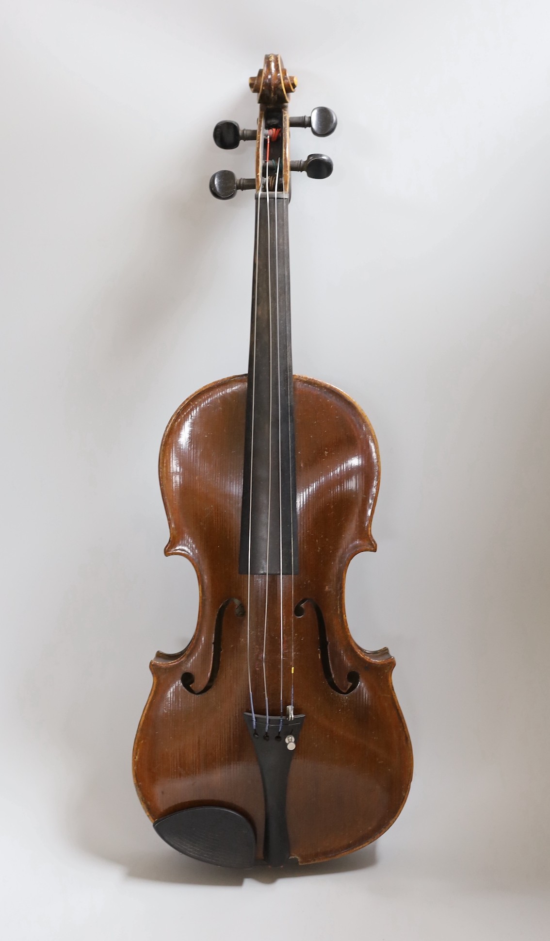 A Maidstone violin, with bow, cased. violin 59 cms high.